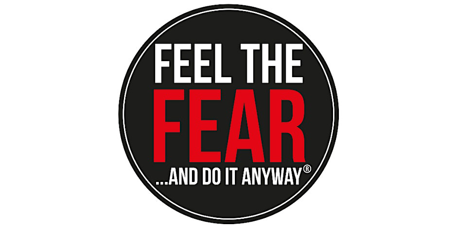 Logo for the Feel the Fear and do it anyway event, white text inside a black circle with the word Fear written in bold red text
